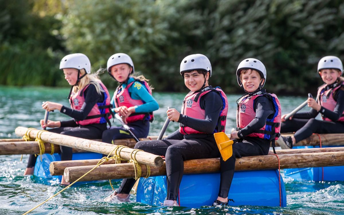 Group of children on a raft in Willen Lake