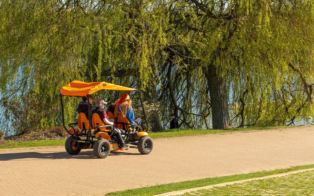 Four people on Adventure Cycle buggy