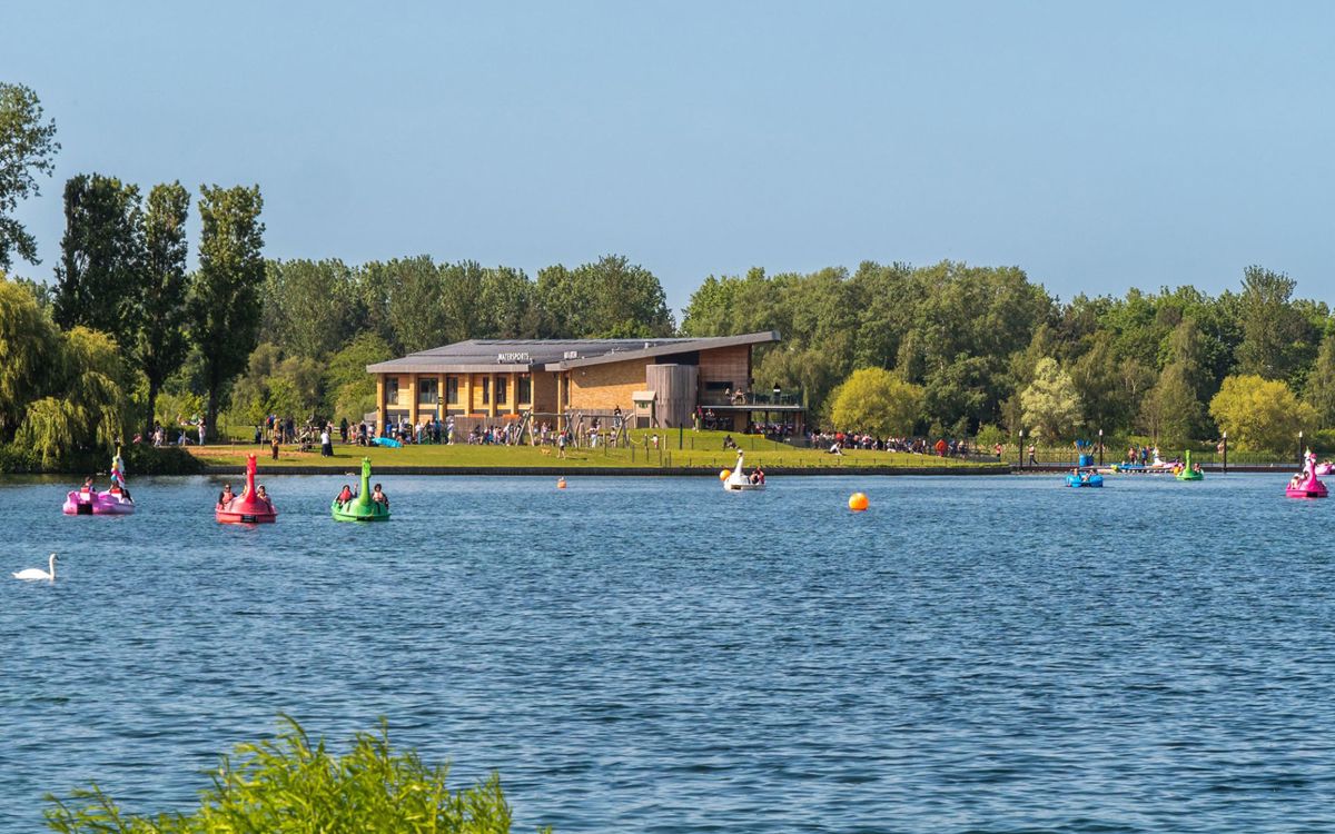 Willen Lake with pedalos and activities with Watersports Centre in distance