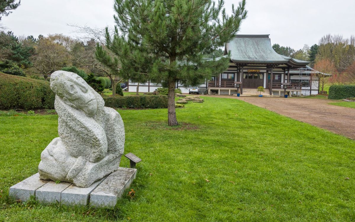 Hiroshima Departed stone sculpture outside of Japanese temple at Willen Lake