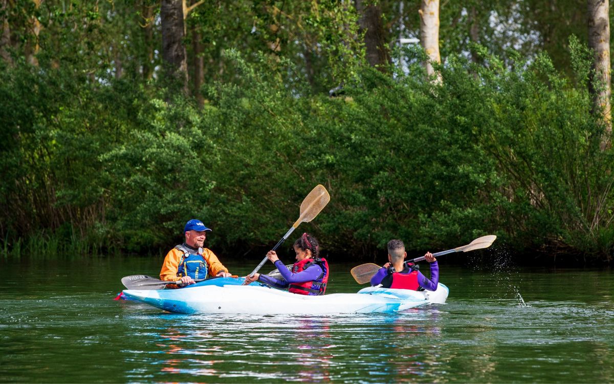 Instructor and two participants kayaking on Willen Lake